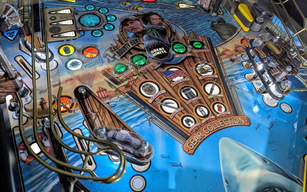 The playfield on a Jaws pinball machine by Stern Pinball.