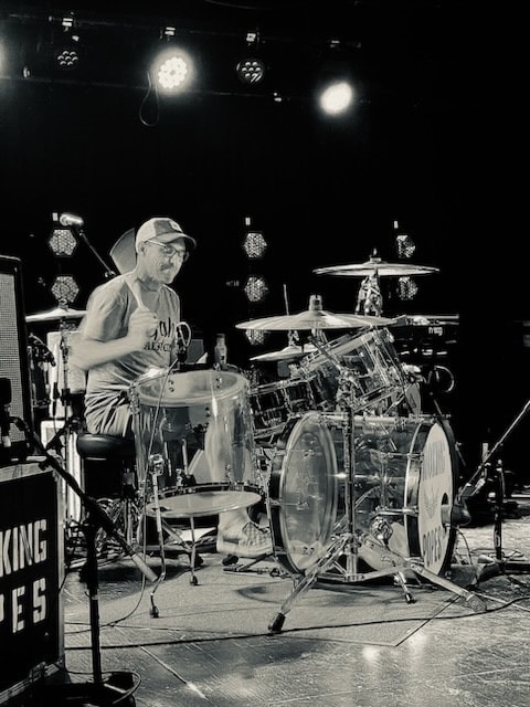 Mike Felumlee playing drums