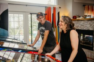 Mike & Steph playing pinball at home.